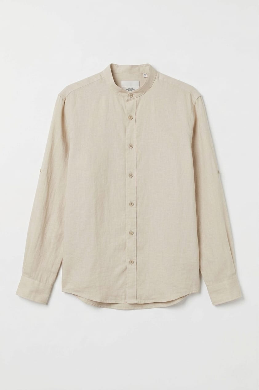 Beige button-up shirt on a white background