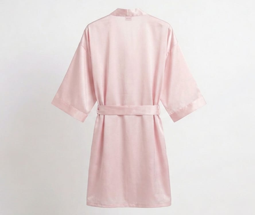 Pink satin robe on a light gray background